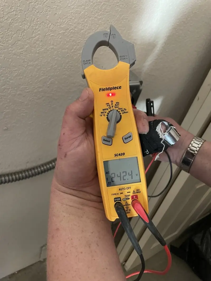 Voltage testing with clamp meter during Whole House Surge Protector in Beaver